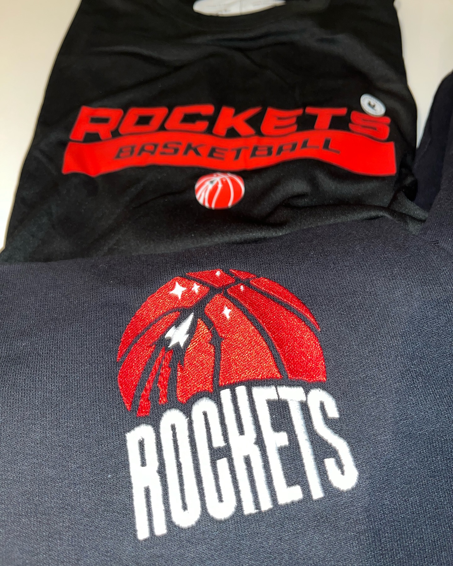 Screen print and embroidery on club fleece.