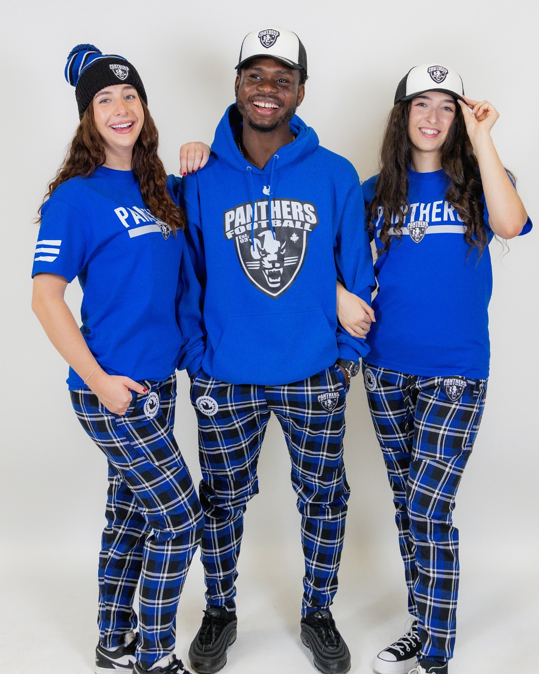 Full team package — hoodies, tees, caps, toques and plaid pants.