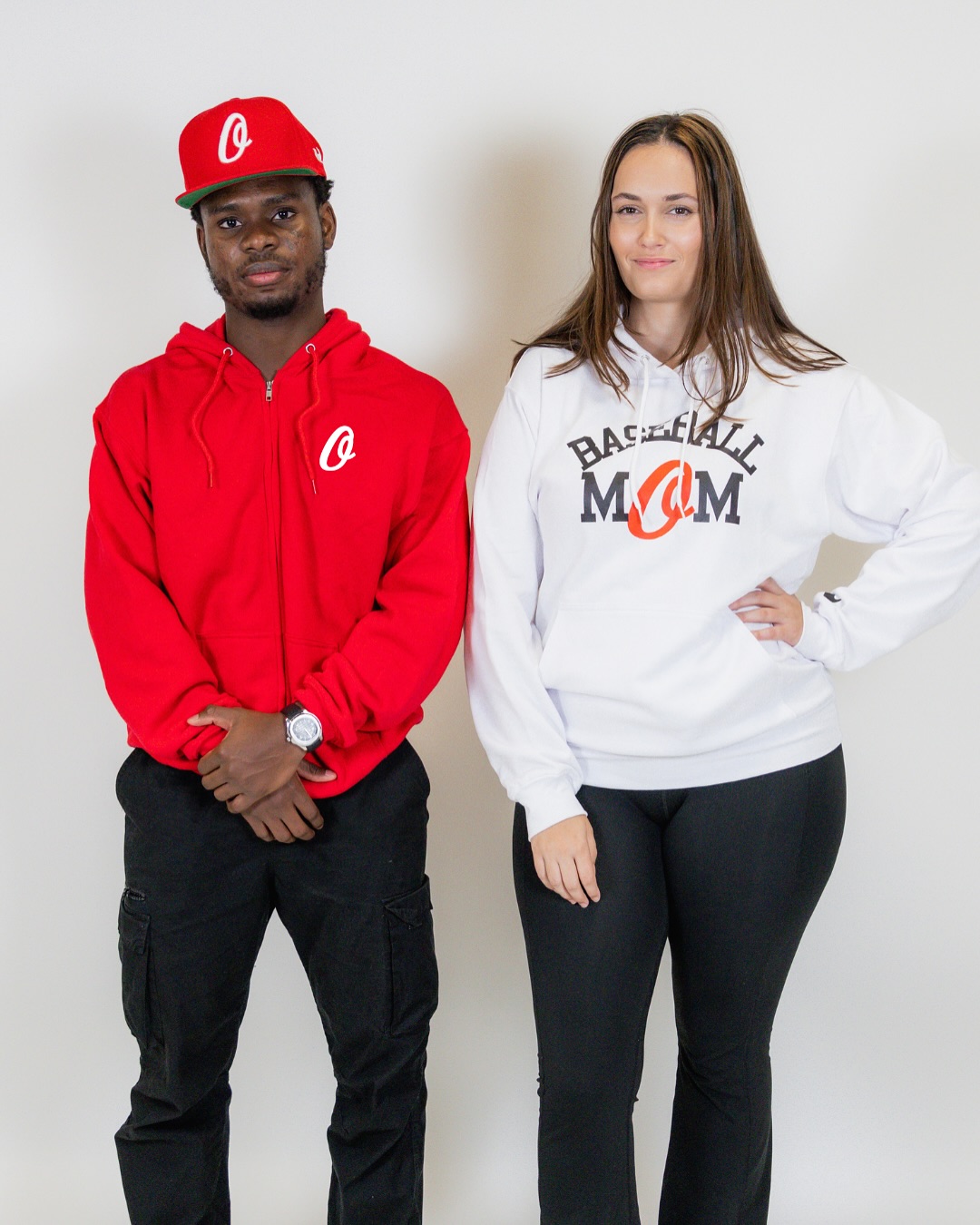 Zip hoodies, cap and supporter merch on model.